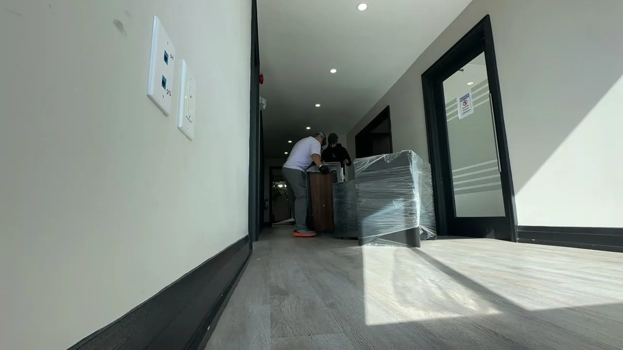 The Optimum team preparing furniture during a move